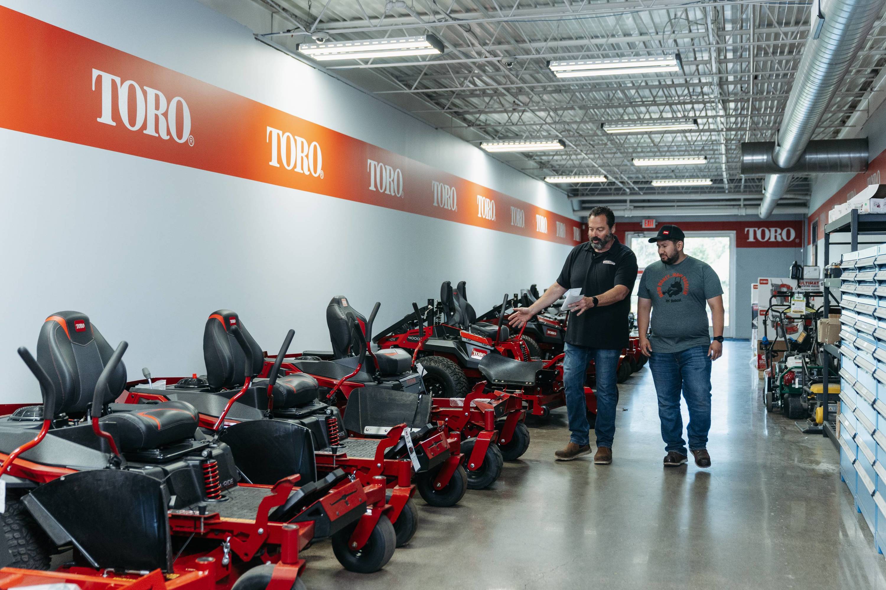 Customer browsing toro mowers
