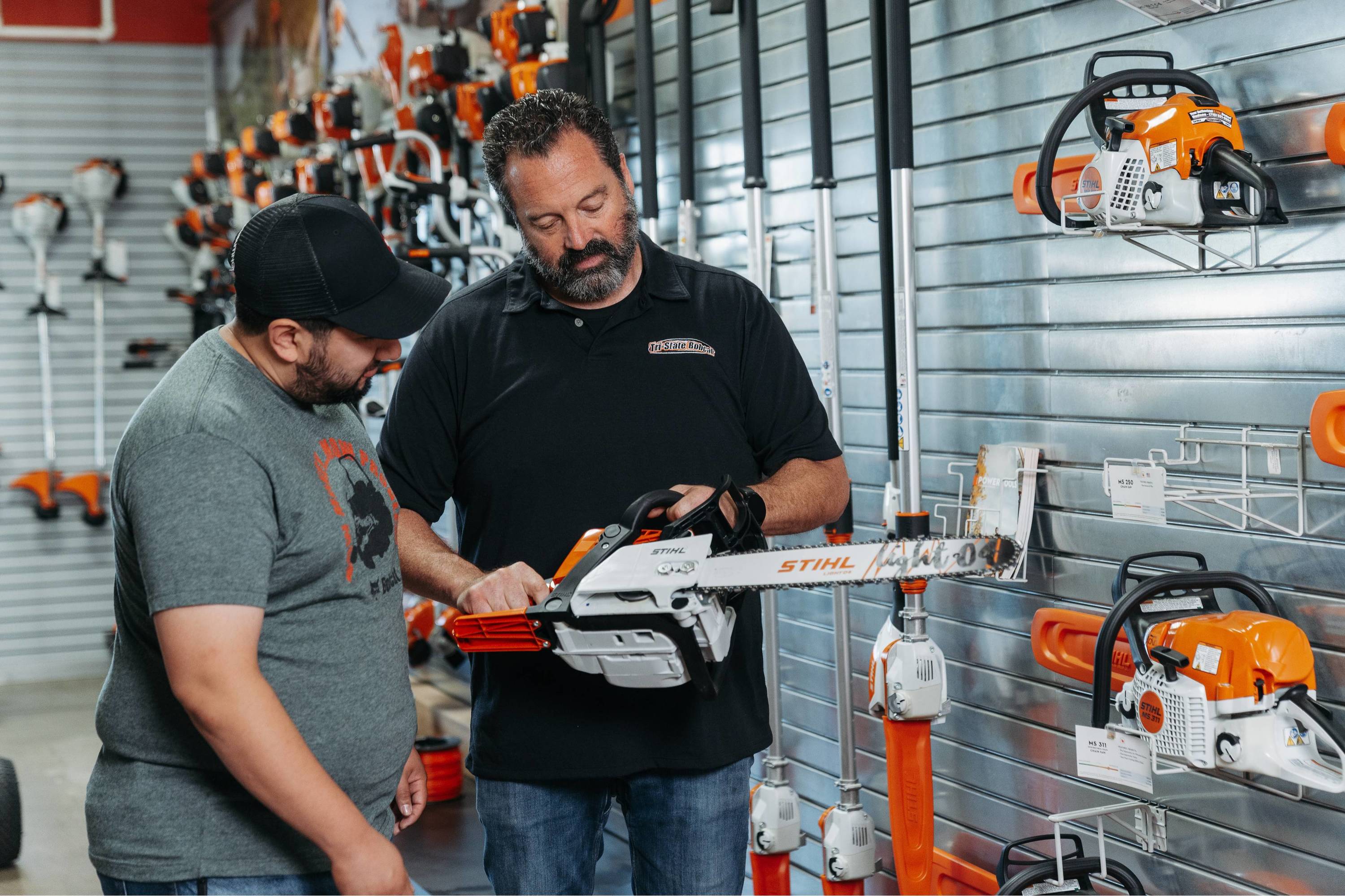 Customer looking at stihl chainsaw