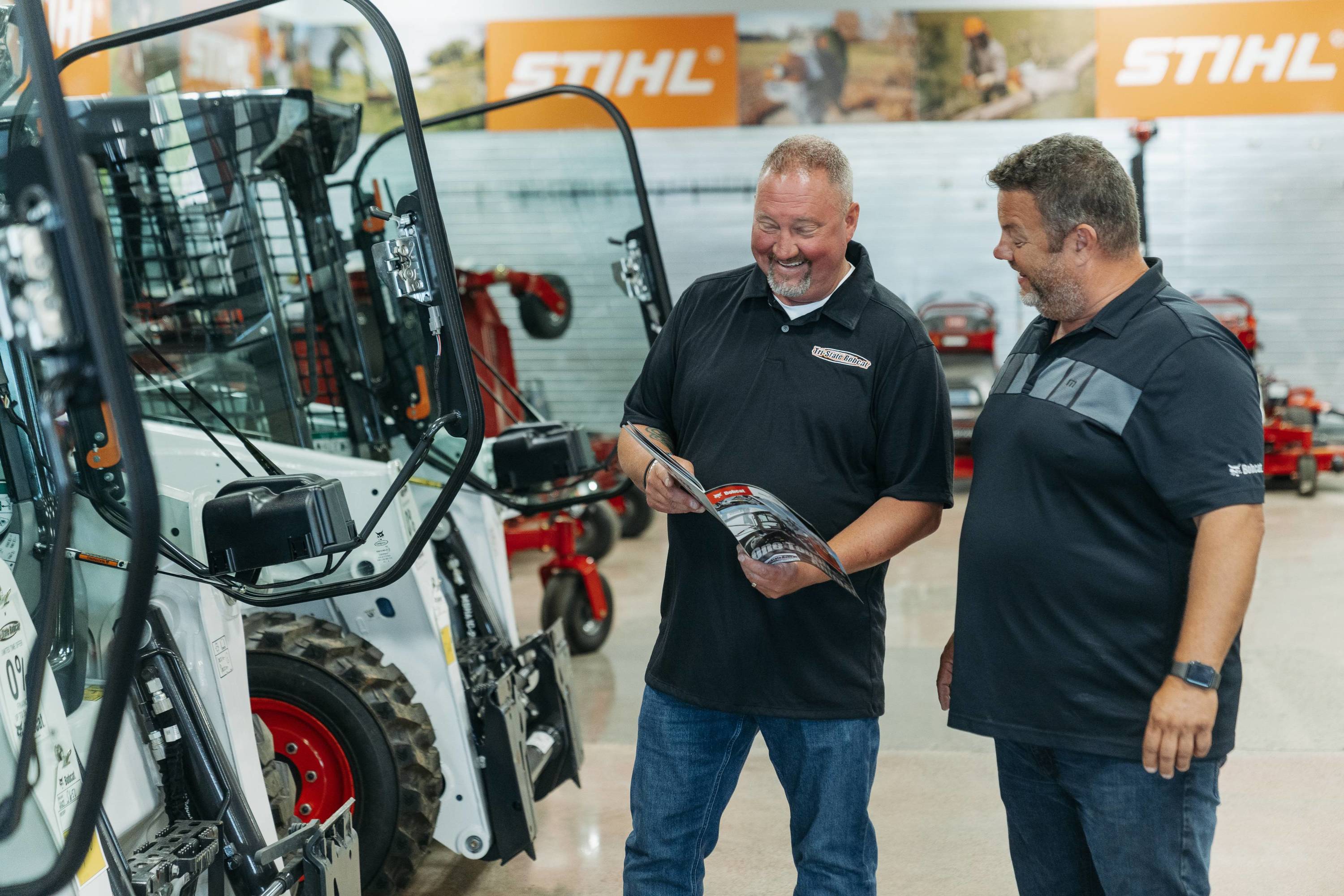 customer learning about bobcat skid steer