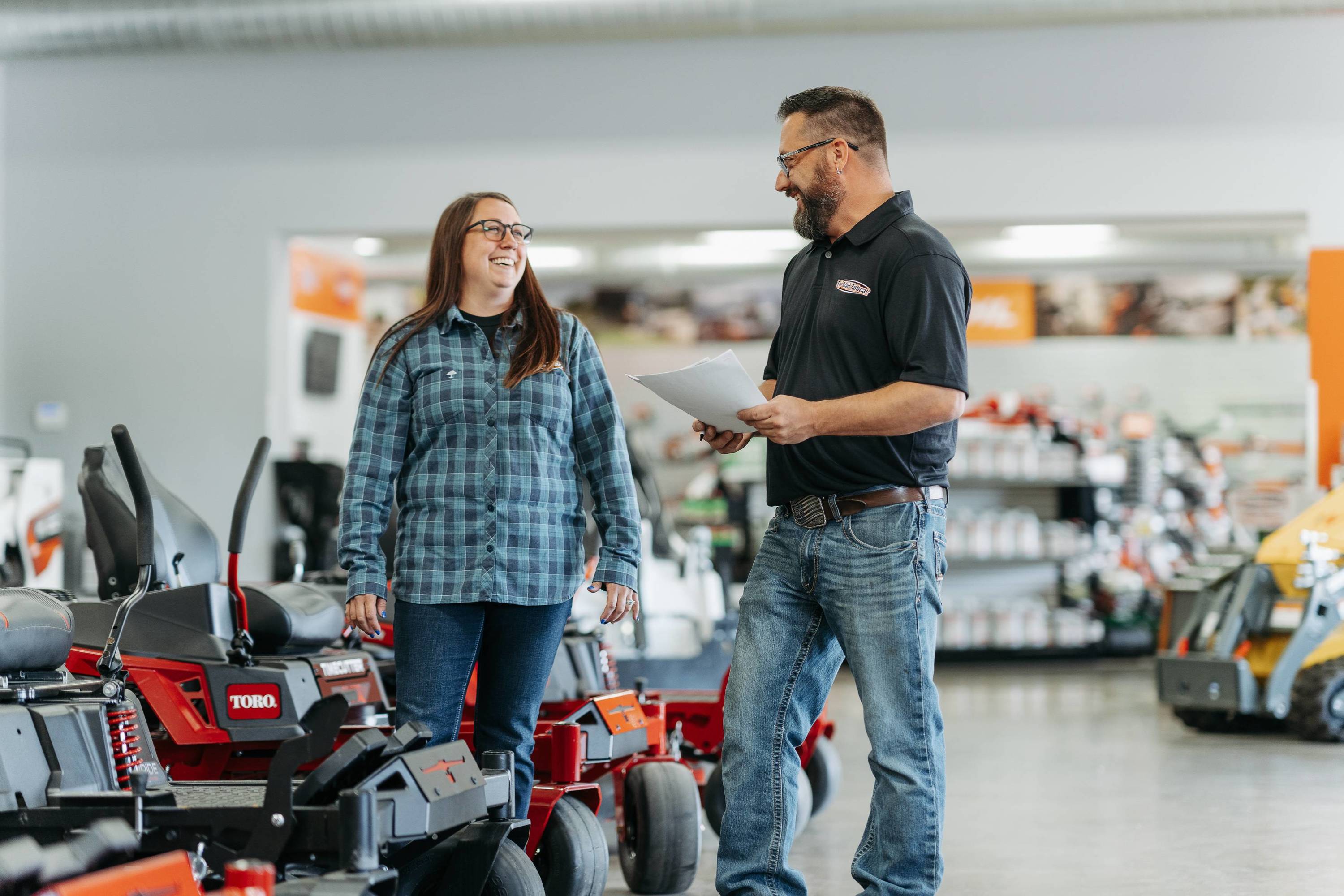Customer looking at toro mowers